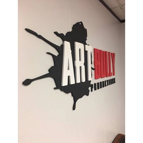 Black, Red, and White Paint Splatter 3D Logo on Wall